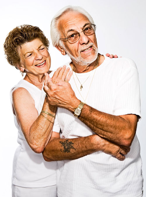 An older couple smiling and laughing