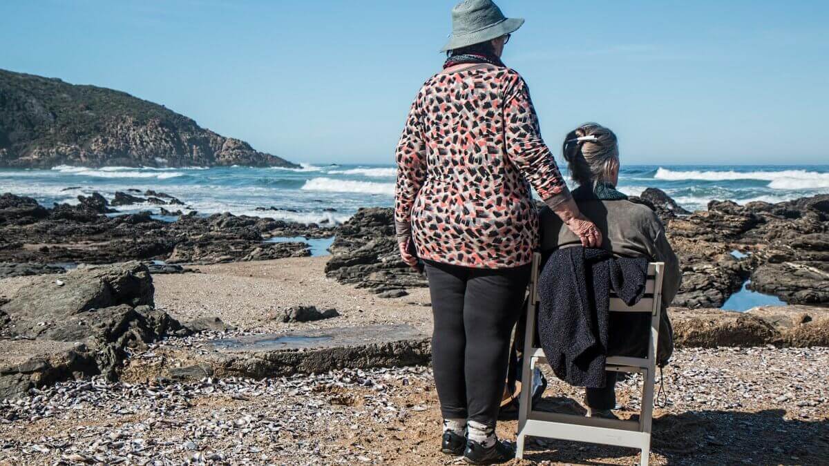 A woman caring for aging parent and spending time at the coast with her