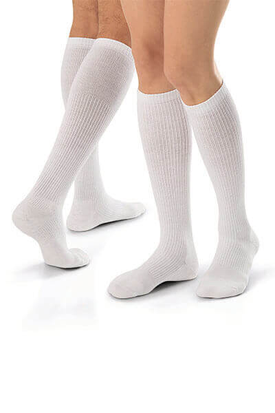 Close up of people’s legs wearing JOBST® compression garments